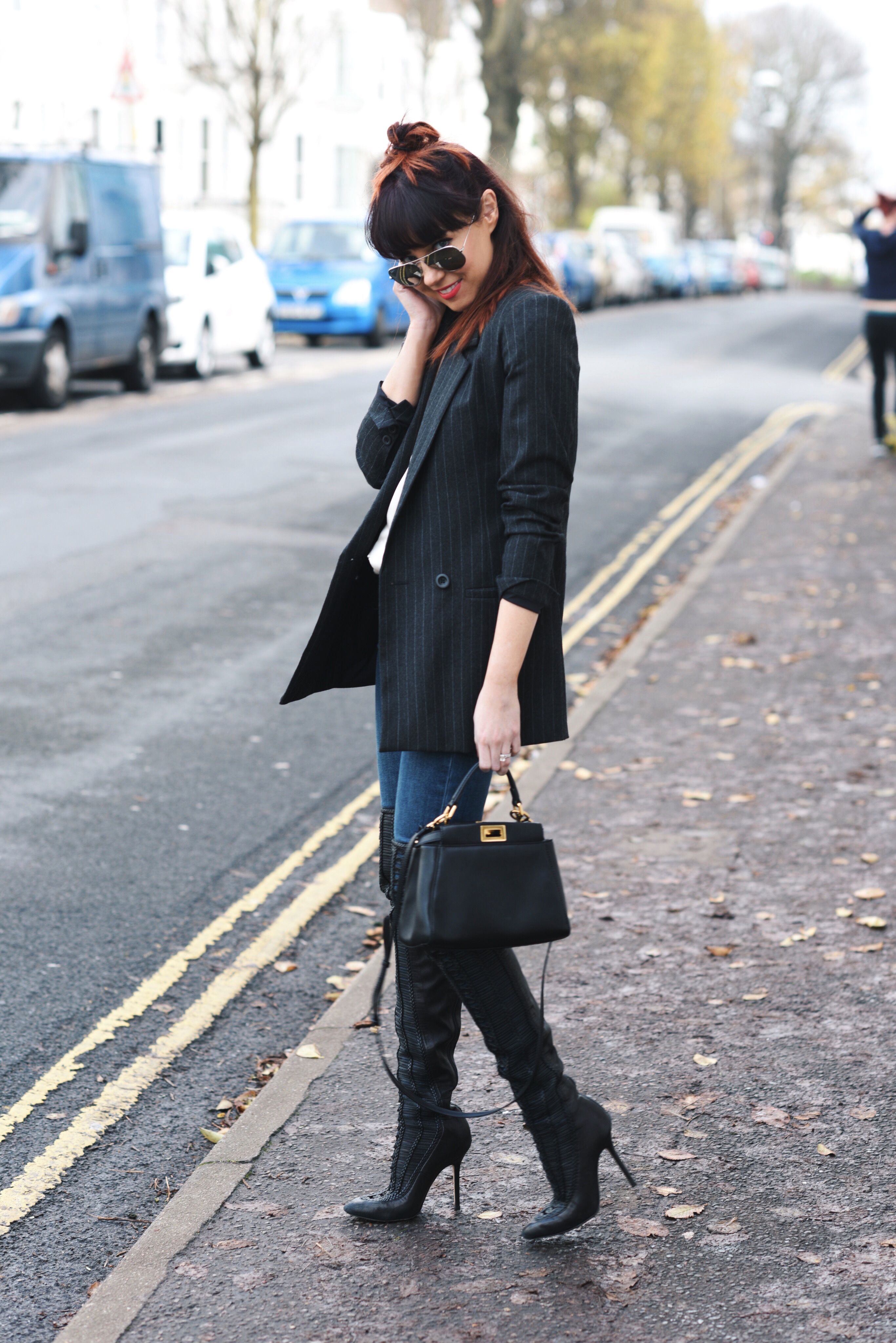pinstripe jacket and over the knee boots
